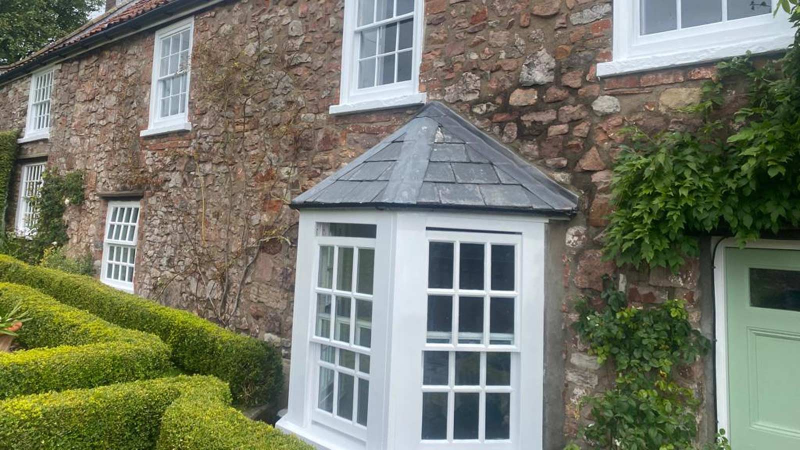Timber sash windows fitted to a stone period property in Backwell